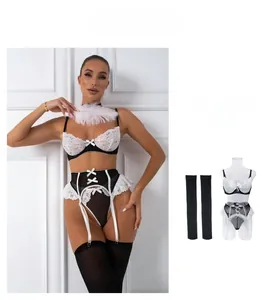 Detailed view of sexy lace maid lingerie set in black and white with bow accents