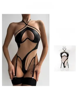 Detail of khaki and black PU leather bodysuit with hollow-out design and garter straps