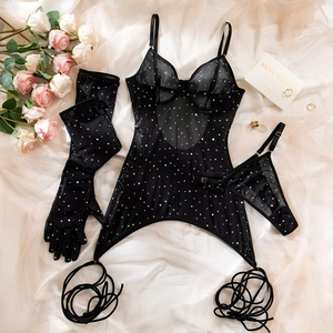 Close-up of black mesh lingerie set with colorful rhinestones and matching gloves