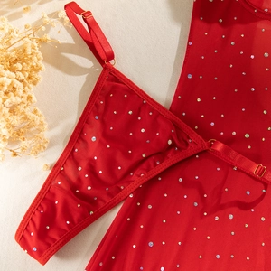 Detail of red mesh lingerie with sequins and adjustable straps featuring gold metal buckles