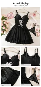 Detailed close-up of black lace babydoll with pink bow accents and adjustable straps