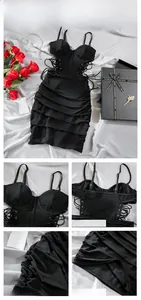 Detail of black corset dress with metal eyelets, crisscross lacing and side ruching texture