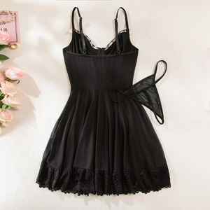 Close-up of black lace babydoll sleepwear with pink bow detail and matching thong