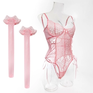 Detailed close-up of pink lace teddy lingerie set with matching fishnet stockings