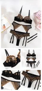 Detail of black mesh lingerie set featuring golden chain embroidery and garter belt