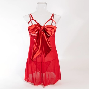 Detail of red mesh babydoll with oversized satin bow and delicate lace trim accents