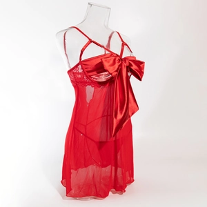 Detail of red mesh babydoll featuring a satin bow and lace trim on the bust area