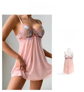 Detailed view of pink mesh babydoll with intricate floral lace embroidery and underwire bra