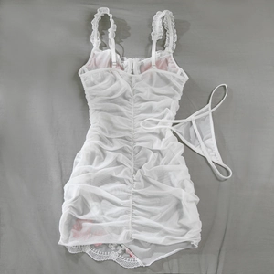Flat lay of white mesh bodysuit featuring ruffled straps and pink floral lace details