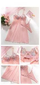 Detail of pink mesh babydoll with floral embroidery, adjustable straps, and back hook closure