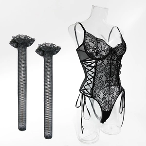 Lace bodysuit detail showing intricate floral patterns, criss-cross straps and stockings