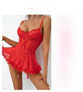 Detail of red lace bodysuit with fishbone corset and sheer polka dot mesh ruffles