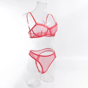 Detail of red mesh bra set with ruffled lace trim and underwire on a clear mannequin