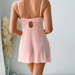 Detail view of pink mesh babydoll with adjustable straps and cutout back design