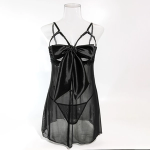 Detail of sheer mesh lingerie set with oversized satin bow and adjustable straps