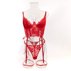 Detail of red floral lace lingerie set with underwire cups and decorative waist drawstring