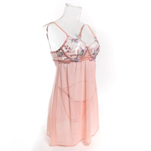Detail of pink mesh nightdress with delicate floral embroidery and sheer lace texture