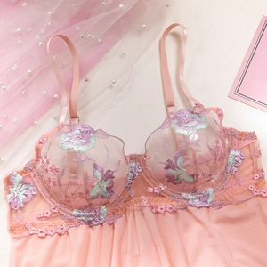 Detail of pink mesh babydoll with colorful floral embroidery and underwire lace cups