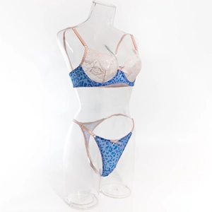 Detailed view of pink lace cups and blue leopard print side panels on underwire bra set