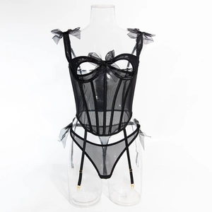 Detailed view of sexy black sheer mesh corset with bow accents and garter straps