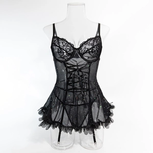 Detail of black lace bodice with sequined mesh skirt and adjustable garter straps
