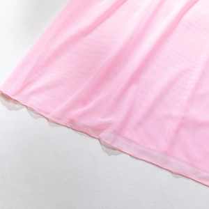 Detail shot of the bright pink sheer mesh fabric and fine seam finishing on the dress