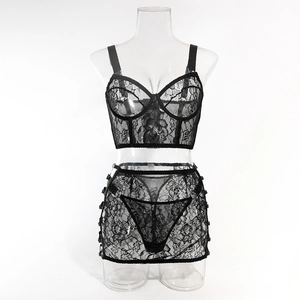 Close-up of black floral lace bra and skirt set with adjustable straps and metal buckles