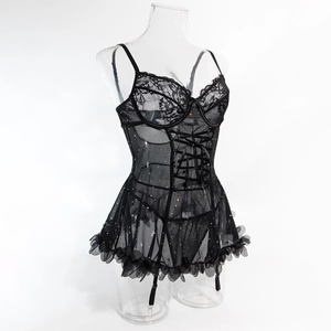 Detail of black lace lingerie set featuring sequin embellishments and ruffled skirt hem