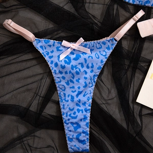 Close-up of blue leopard print thong with pink bow and adjustable side straps