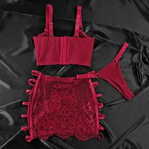 Detailed close-up of wine red lace lingerie three-piece set with metal rings and ribbons