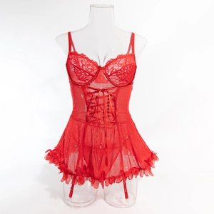 Detail of red lace lingerie set with corset ribbon, sequined mesh, and garter straps