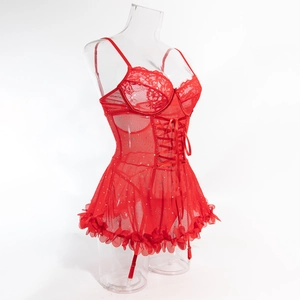 Detail of red lace bodysuit with floral mesh skirt, sequins, and adjustable garters