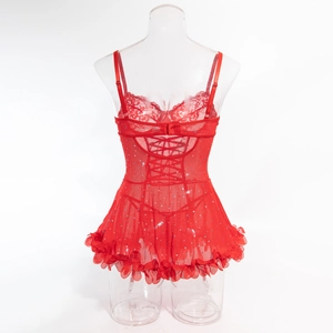Macro detail of red sequined corset back with lace trim and adjustable criss-cross lacing