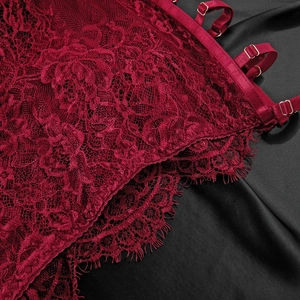 Close-up of wine red floral lace dress featuring fine eyelash edges and gold metal buckles