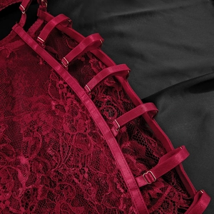 Close-up of burgundy lace lingerie showing floral patterns and adjustable gold buckles
