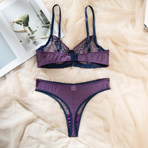Detailed view of the purple lace lingerie set with adjustable straps on soft tulle