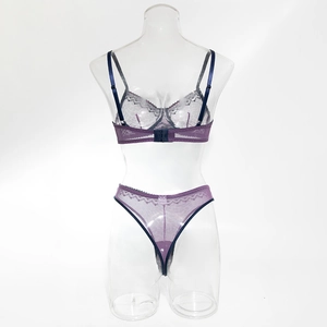 Back view of dark purple lace lingerie set with mesh details on a clear mannequin