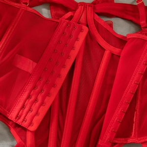 Close-up of red mesh corset back with four-row hook-and-eye closure and adjustable straps