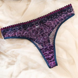 Detailed view of purple leopard print mesh thong with black eyelash lace and size S tag