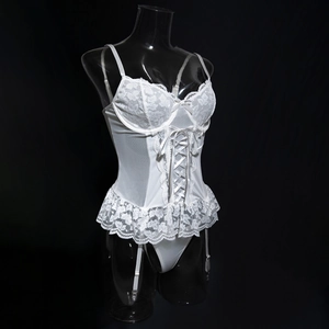 Detailed white lace lingerie set with underwire cups and adjustable crisscross ribbon waist