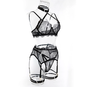 Detail view of floral eyelash lace lingerie with gold hardware and garter belt set