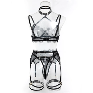 Detail of black eyelash lace bodysuit set with adjustable gold buckles and sheer mesh