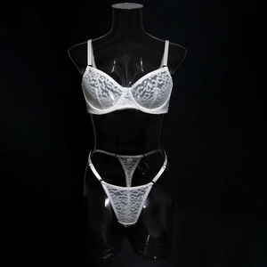 Detailed view of white lace lingerie set with leopard pattern and underwired bra