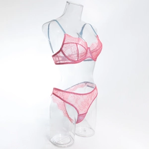 Detailed side view of pink lace lingerie set on transparent mannequin with wired bra