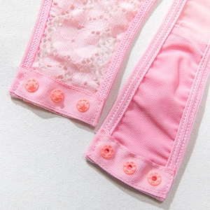 Detail of light pink lace bodysuit featuring three resin snap button closures and floral mesh
