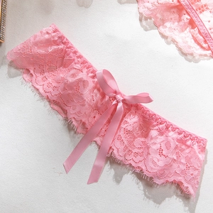 Detailed shot of pink eyelash lace leg garter featuring a delicate satin ribbon bow