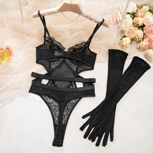 Detailed close-up of sexy black lace bodysuit set with matching long mesh gloves