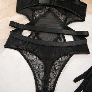 Detailed view of black floral lace embroidery and sheer mesh hollow-out lingerie set