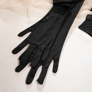 Detail of long black sheer mesh gloves for elegant evening gowns and wedding party attire