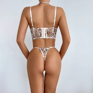 Dessous-Set mit Blumenstickerei, Spitzen-Korsett und T-Back in der Rückansicht
